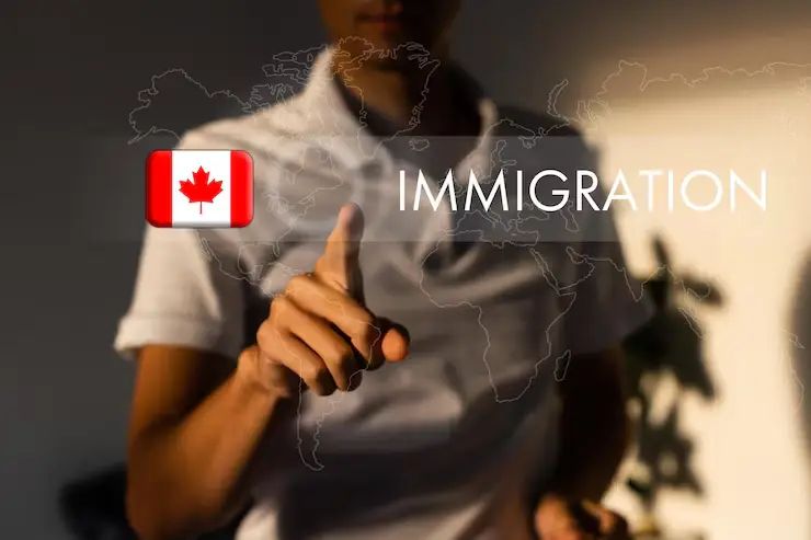 Person pointing at Canada immigration sign with flag, related to Canadian Citizenship Test