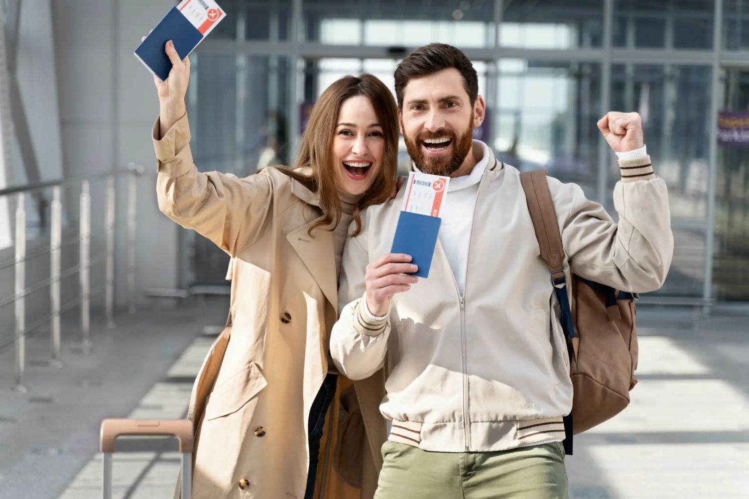 Happy travelers holding passports and boarding passes, representing the upcoming availability of digital vaccine passports in Canada